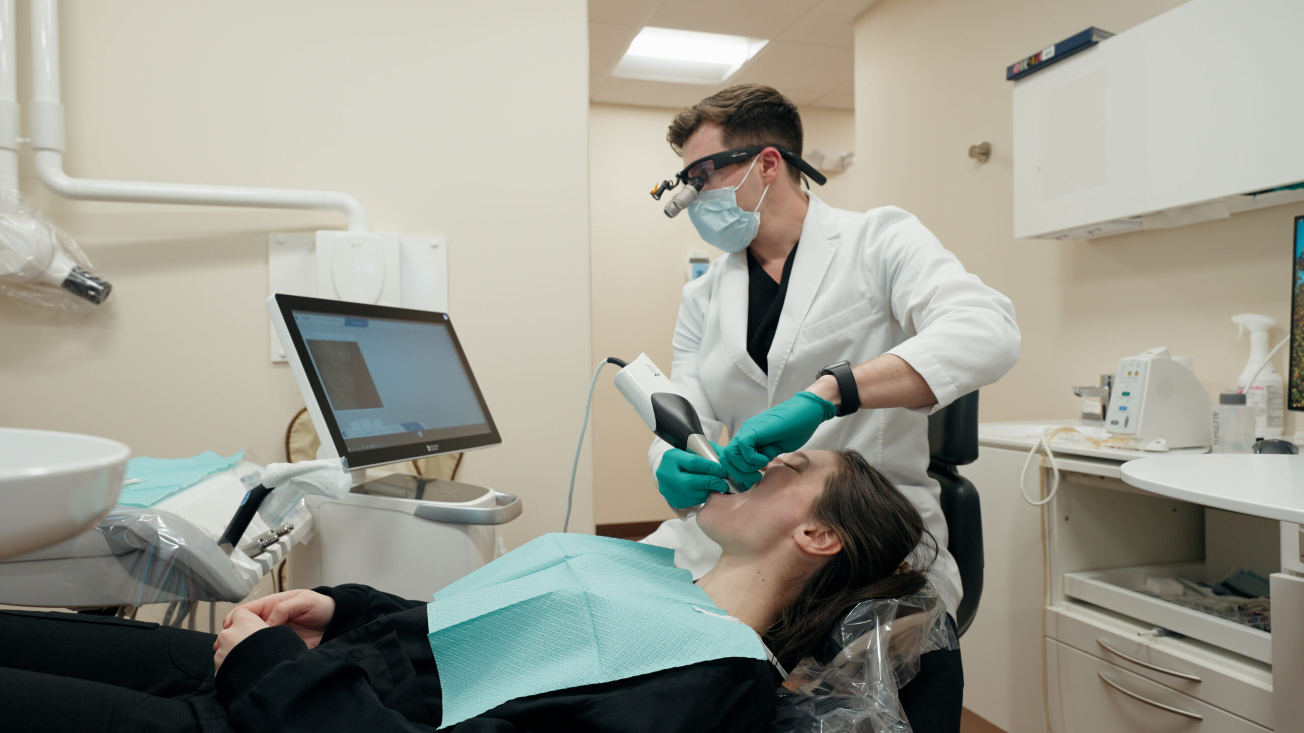 Dentist discussing an implant treatment plan with a patient