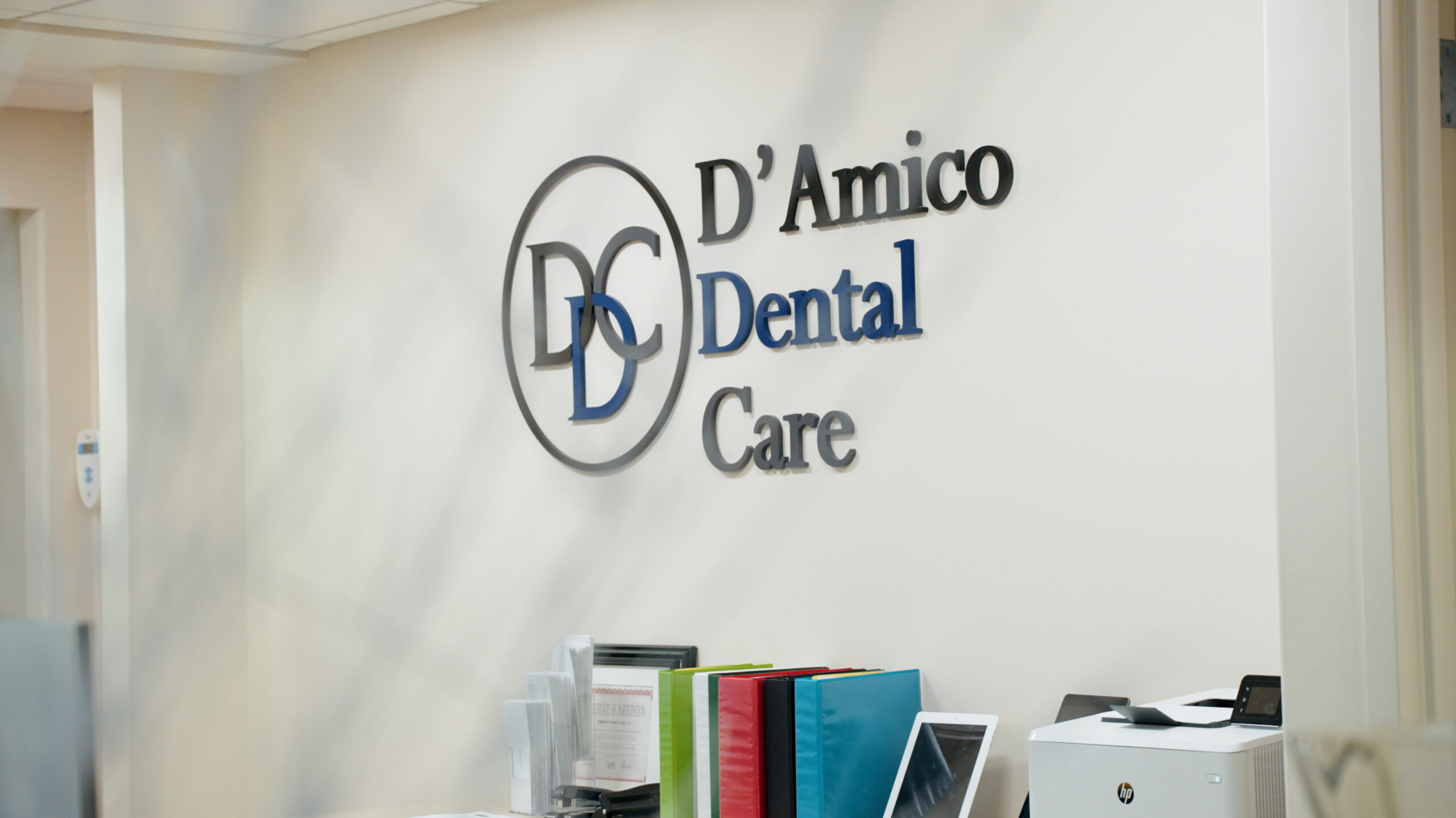 D'Amico Dental Care logo and branding displayed in the Watertown office