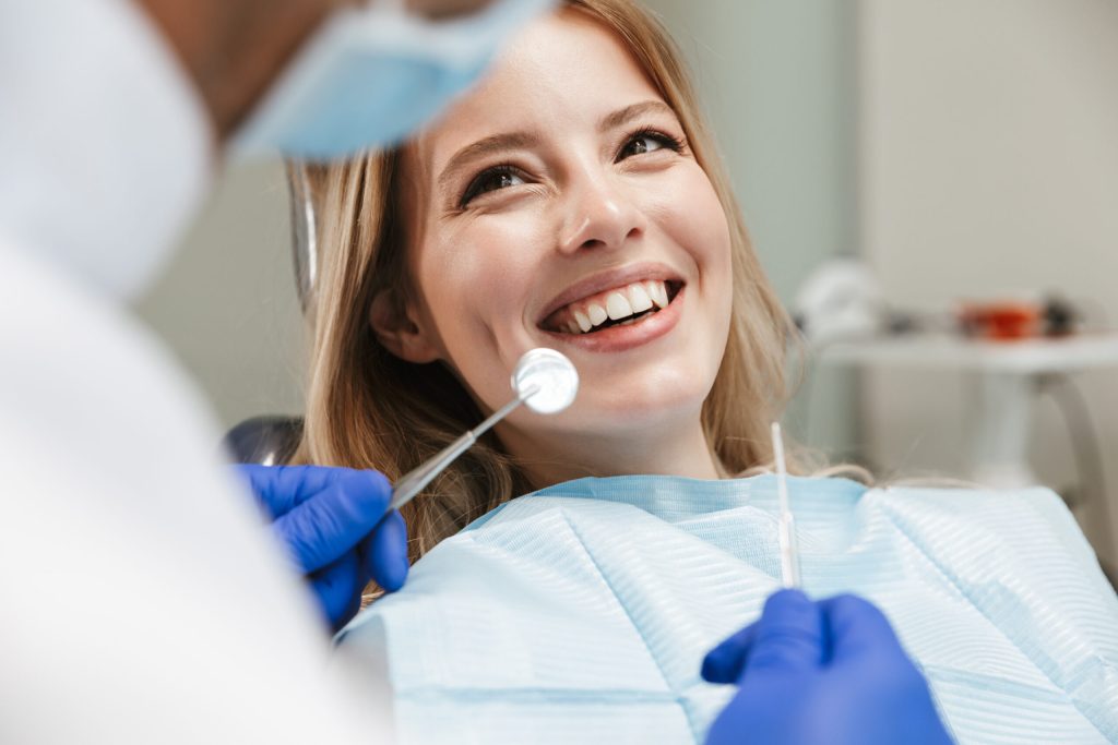 young woman in dental chair at medical center